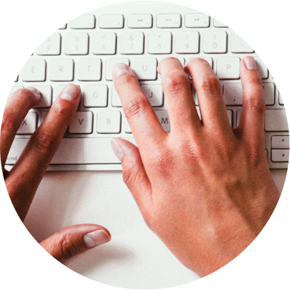 homepage-keyboard-circle Hands typing on a keyboard